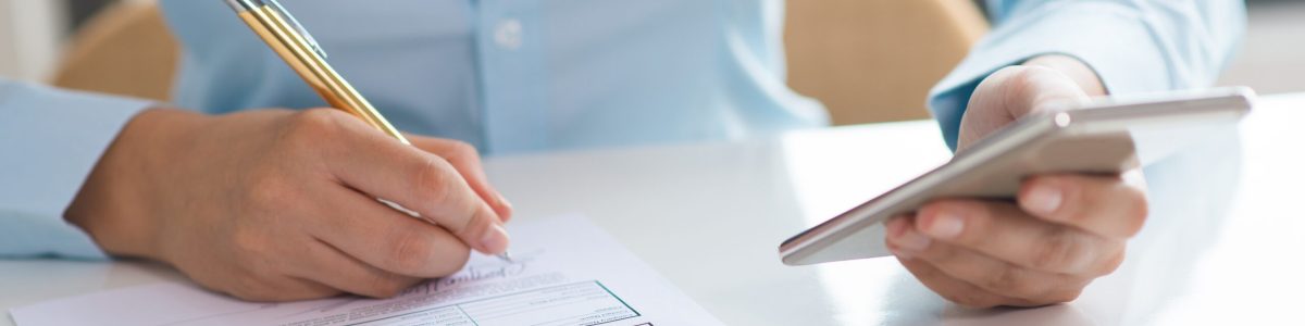 Closeup of woman signing document and holding smartphone Closeup of woman signing document and holding smartphone. Document lying on table. Contract or application concept. Cropped view.