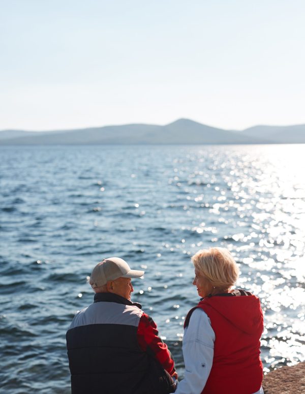 Serene senior couple talking and relaxing in natural environment